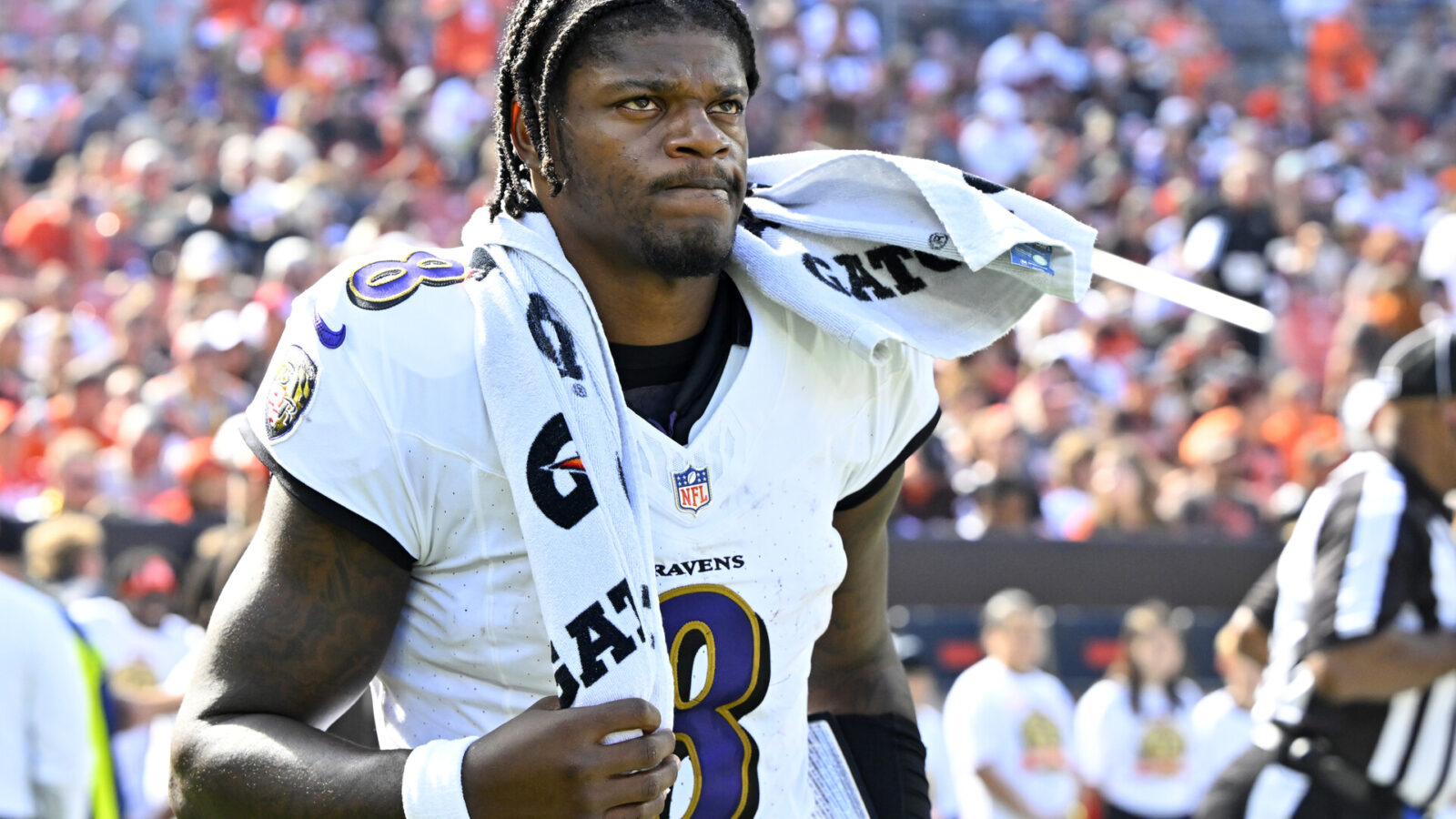 Baltimore Ravens quarterback Lamar Jackson (8) walks on the field at halftime of a game against the Cleveland Browns at Cleveland Browns Stadium.