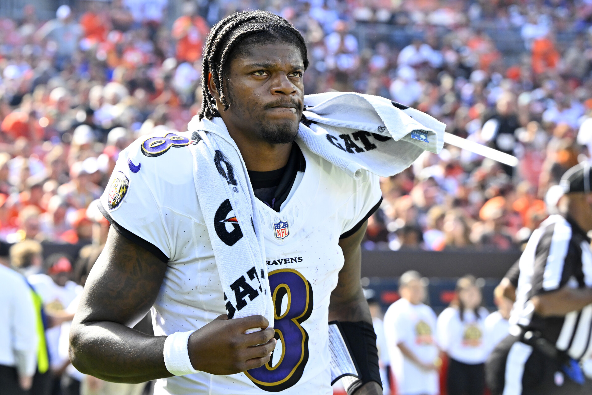 Baltimore Ravens quarterback Lamar Jackson (8) walks on the field at halftime of a game against the Cleveland Browns at Cleveland Browns Stadium.