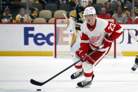 Oct 4, 2023; Pittsburgh, Pennsylvania, USA; Detroit Red Wings left wing Lucas Raymond (23) handles the puck against the Pittsburgh Penguins during the first period at PPG Paints Arena.