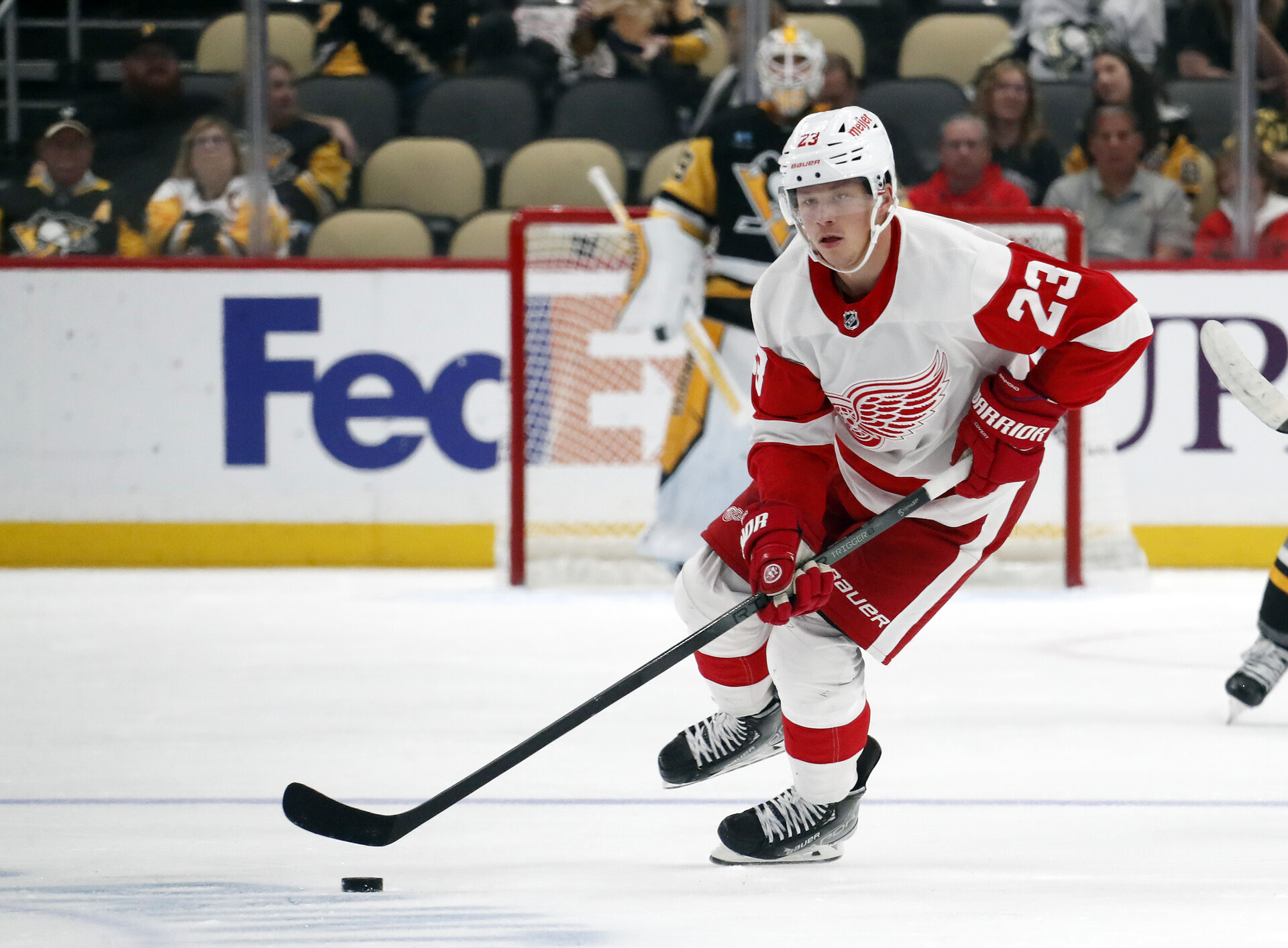 Oct 4, 2023; Pittsburgh, Pennsylvania, USA; Detroit Red Wings left wing Lucas Raymond (23) handles the puck against the Pittsburgh Penguins during the first period at PPG Paints Arena.