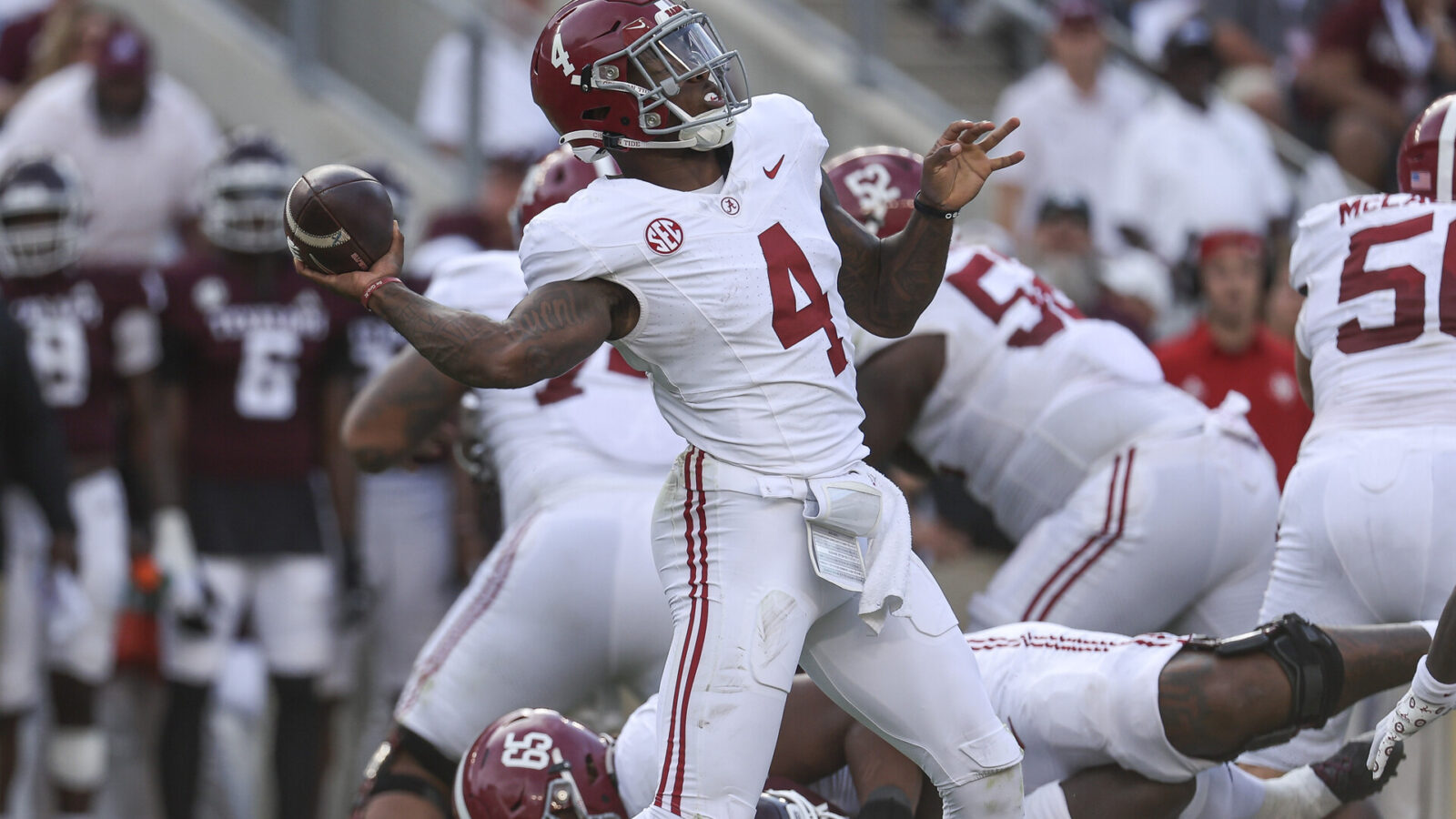 Oct 7, 2023; College Station, Texas, USA; Alabama Crimson Tide quarterback Jalen Milroe (4) throws a pass for a completion during the third quarter against the Texas A&M Aggies at Kyle Field.