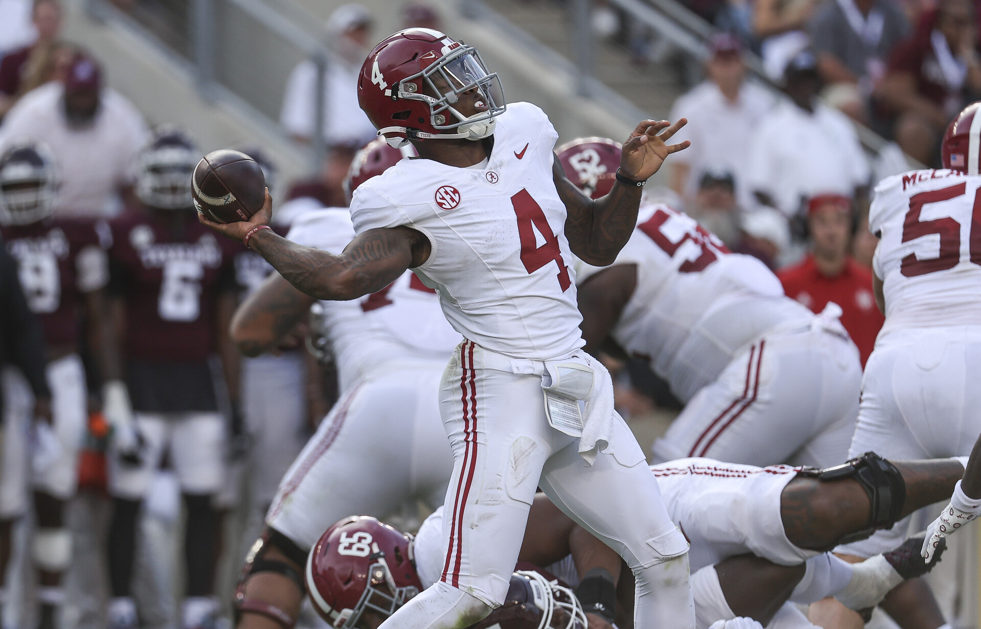 Oct 7, 2023; College Station, Texas, USA; Alabama Crimson Tide quarterback Jalen Milroe (4) throws a pass for a completion during the third quarter against the Texas A&M Aggies at Kyle Field.