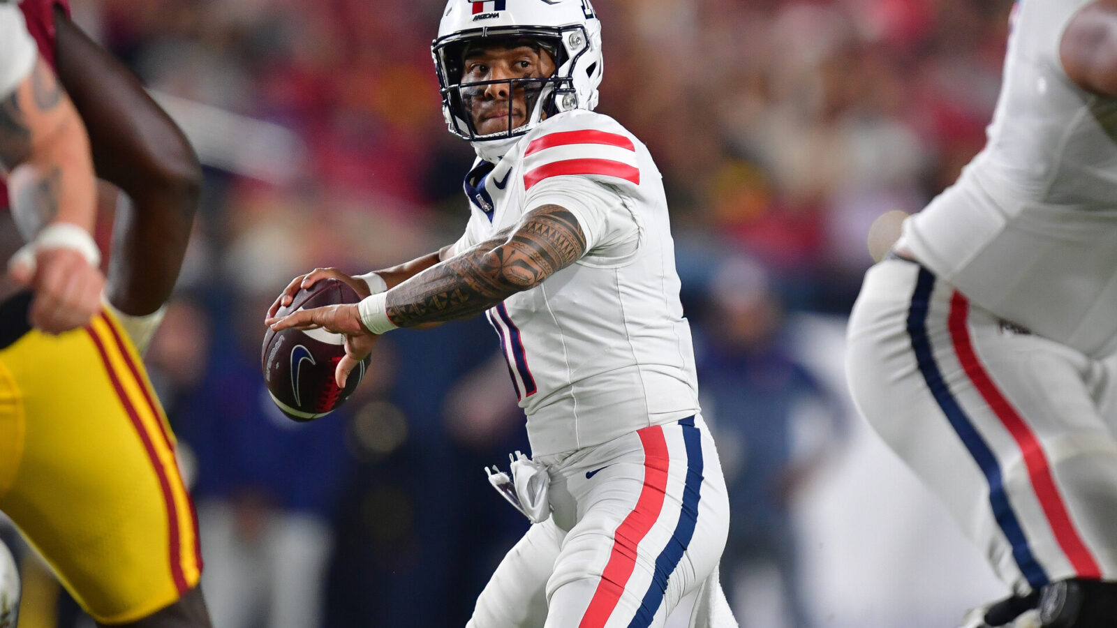 Oct 7, 2023; Los Angeles, California, USA; Arizona Wildcats quarterback Noah Fifita (11) throws against the Southern California Trojans during the first half at Los Angeles Memorial Coliseum.