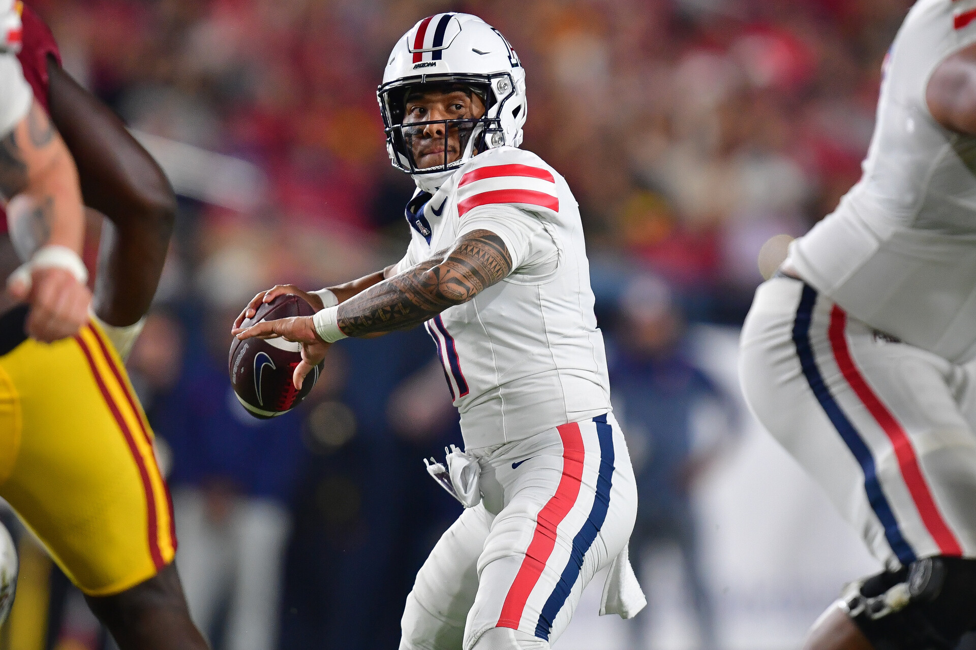 Oct 7, 2023; Los Angeles, California, USA; Arizona Wildcats quarterback Noah Fifita (11) throws against the Southern California Trojans during the first half at Los Angeles Memorial Coliseum.