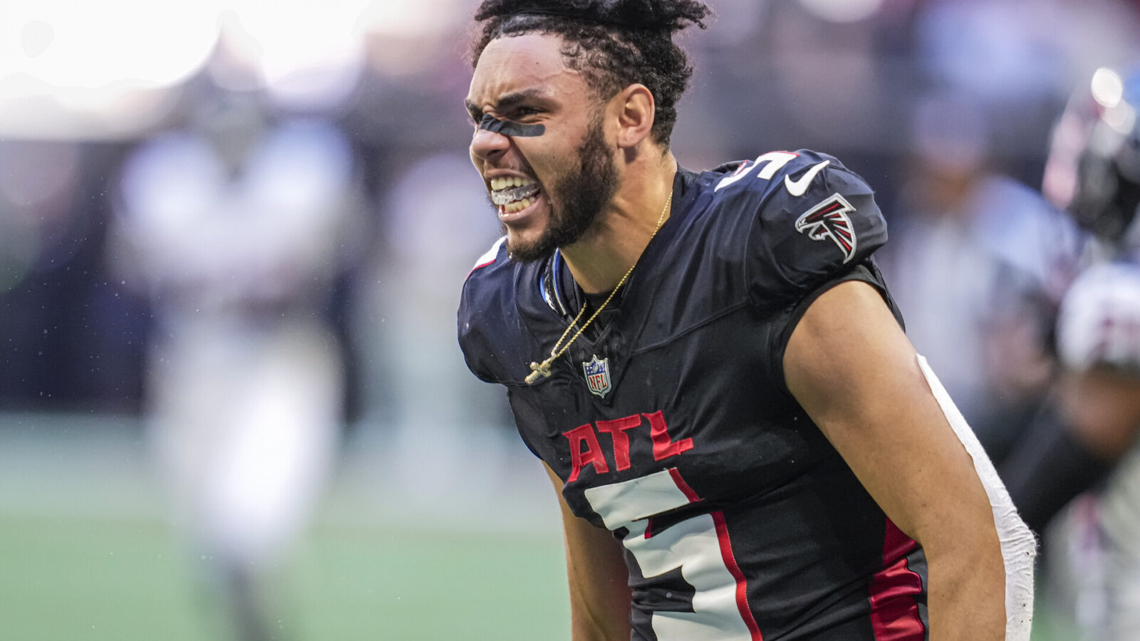 Atlanta Falcons wide receiver Drake London (5) reacts after making a catch and losing his helmet against the Houston Texans during the second half at Mercedes-Benz Stadium.