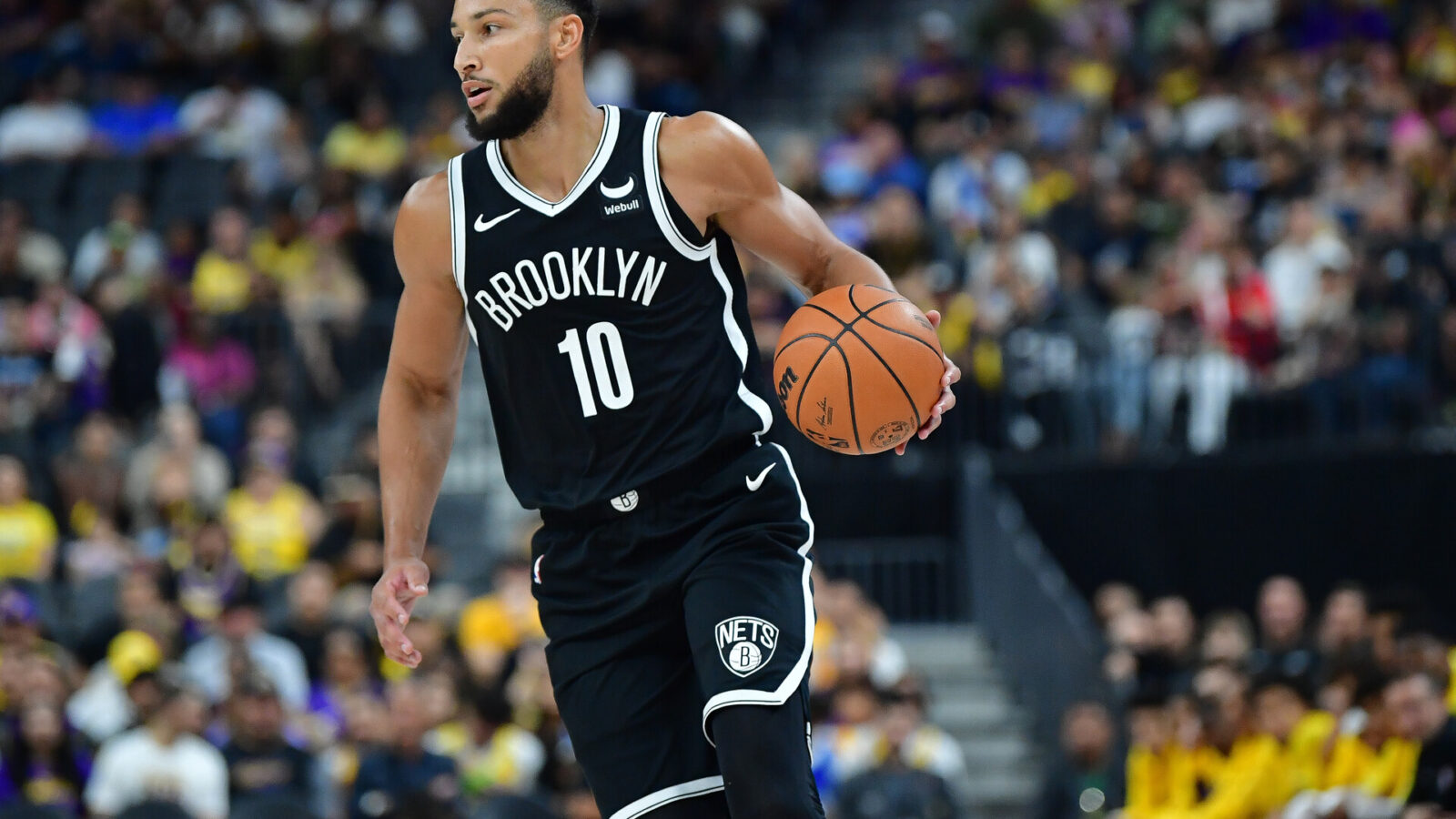 Oct 9, 2023; Las Vegas, Nevada, USA; Brooklyn Nets guard Ben Simmons (10) moves the ball up court against the Los Angeles Lakers during the first half at T-Mobile Arena.