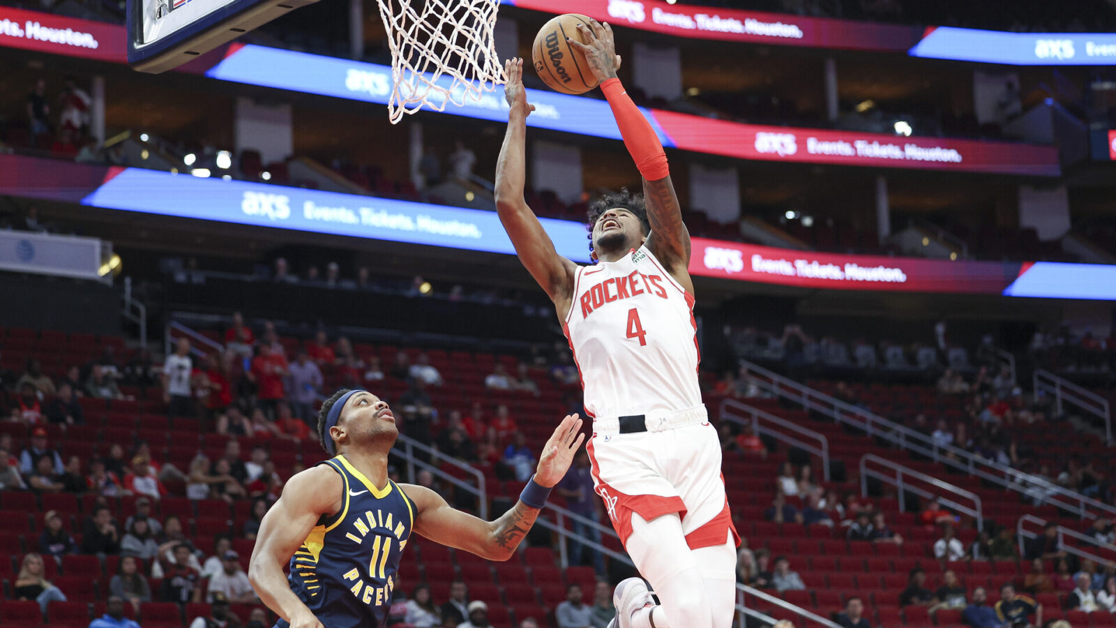 Oct 10, 2023; Houston, Texas, USA; Houston Rockets guard Jalen Green (4) shoots the ball as Indiana Pacers forward Bruce Brown (11) defends during the first quarter at Toyota Center
