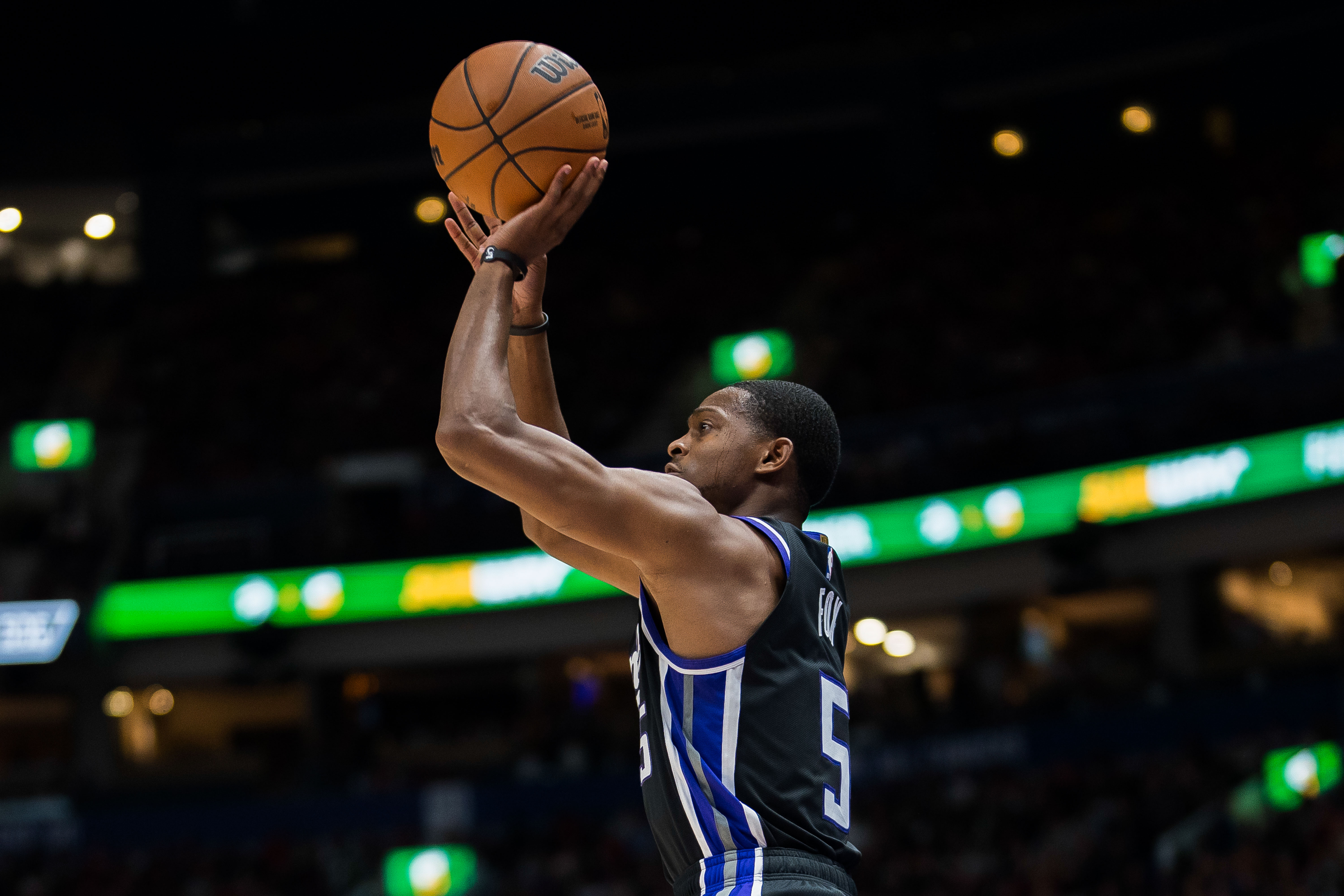 Oct 8, 2023; Vancouver, British Columbia, CAN; Sacramento Kings guard De'Aaron Fox (5) makes a three point attempt against the Toronto Raptors in the first half at Rogers Arena.