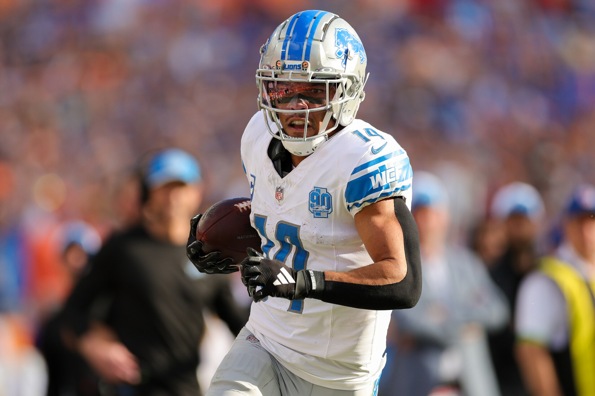 Oct 15, 2023; Tampa, Florida, USA; Detroit Lions wide receiver Amon-Ra St. Brown (14) runs for a touchdown against the Tampa Bay Buccaneers in the second quarter at Raymond James Stadium.