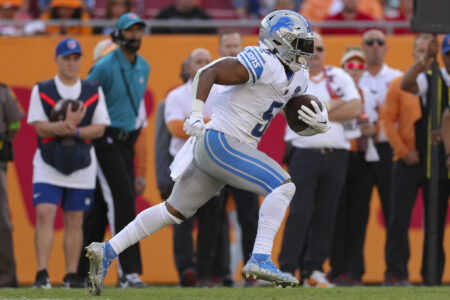 Oct 15, 2023; Tampa, Florida, USA; Detroit Lions running back David Montgomery (5) runs with the ball against the Tampa Bay Buccaneers in the second quarter at Raymond James Stadium.