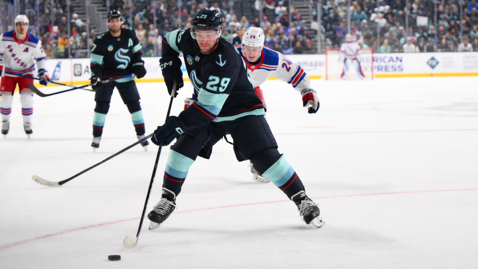 Oct 21, 2023; Seattle, Washington, USA; Seattle Kraken defenseman Vince Dunn (29) plays the puck during the first period against the New York Rangers at Climate Pledge Arena.