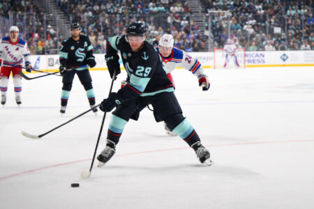 Oct 21, 2023; Seattle, Washington, USA; Seattle Kraken defenseman Vince Dunn (29) plays the puck during the first period against the New York Rangers at Climate Pledge Arena.