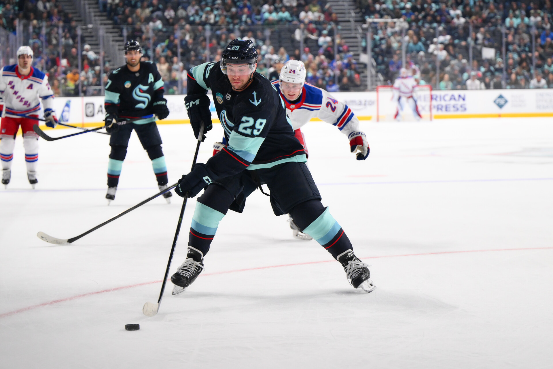 Oct 21, 2023; Seattle, Washington, USA; Seattle Kraken defenseman Vince Dunn (29) plays the puck during the first period against the New York Rangers at Climate Pledge Arena.