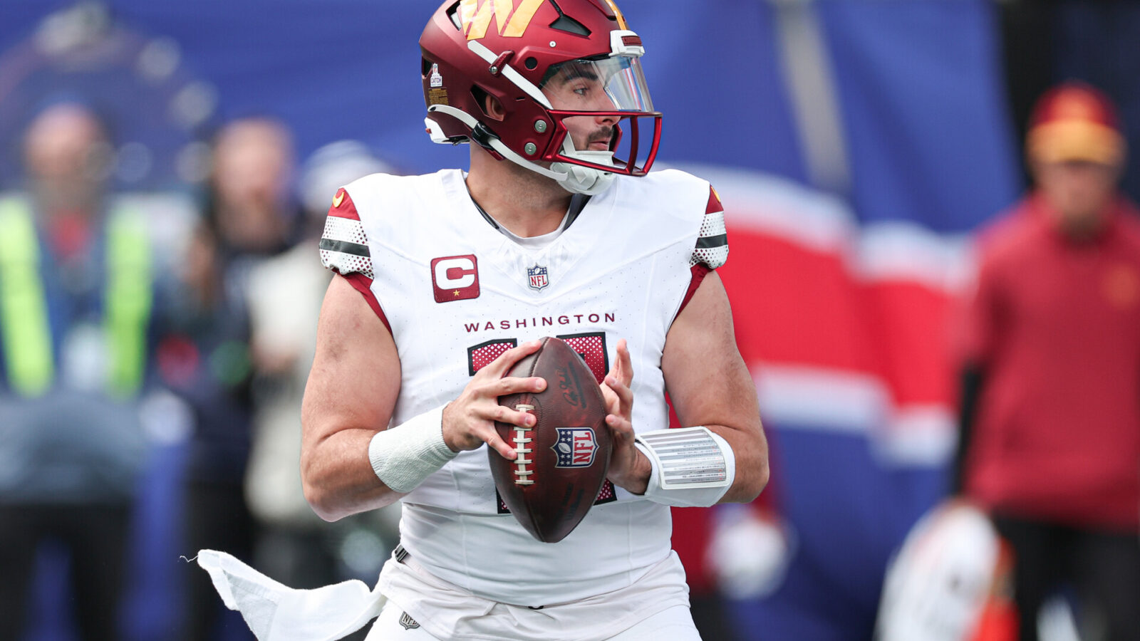 East Rutherford, New Jersey, USA; Washington Commanders quarterback Sam Howell (14) drops back to pass during the first half against the New York Giants at MetLife Stadium.