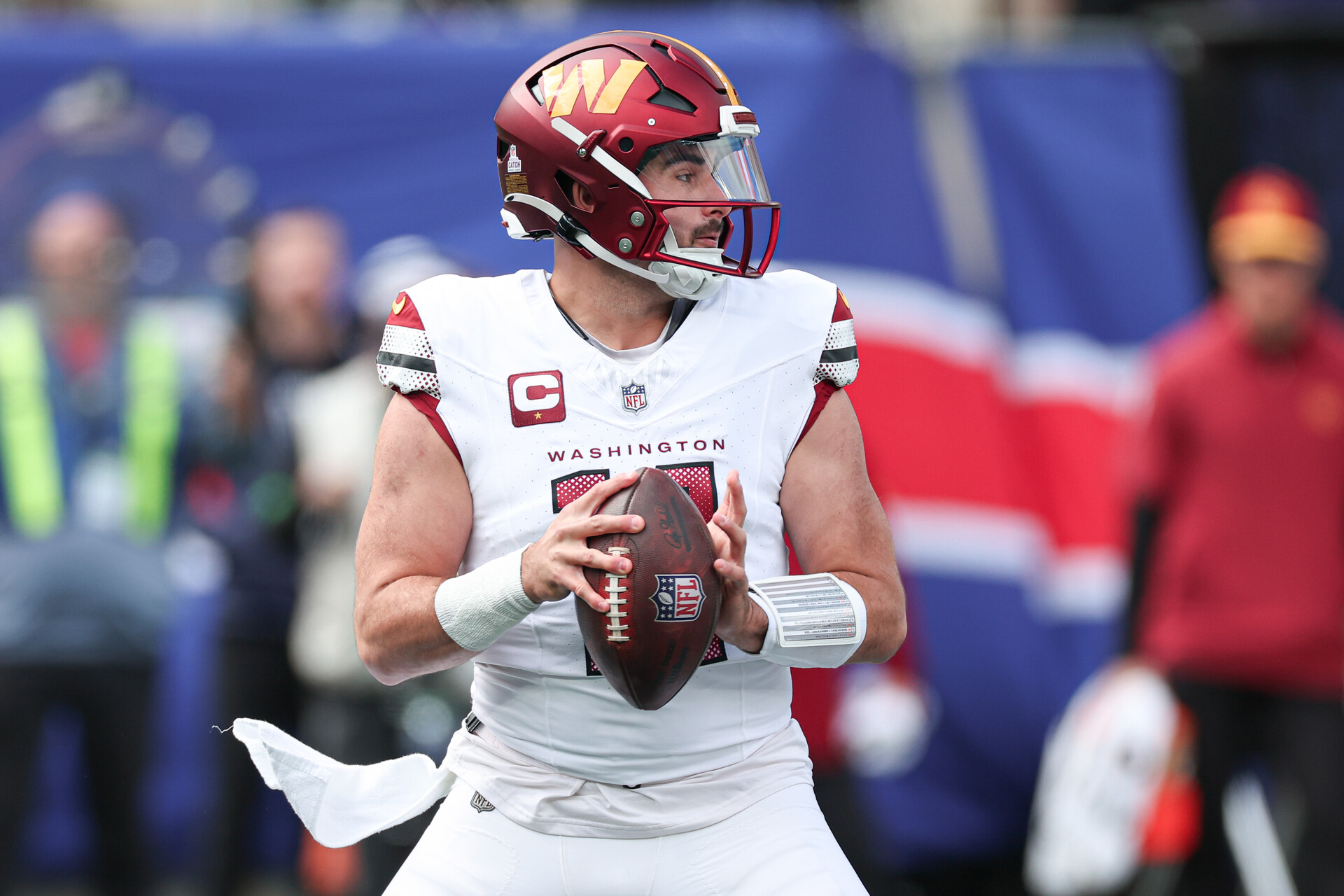 East Rutherford, New Jersey, USA; Washington Commanders quarterback Sam Howell (14) drops back to pass during the first half against the New York Giants at MetLife Stadium.