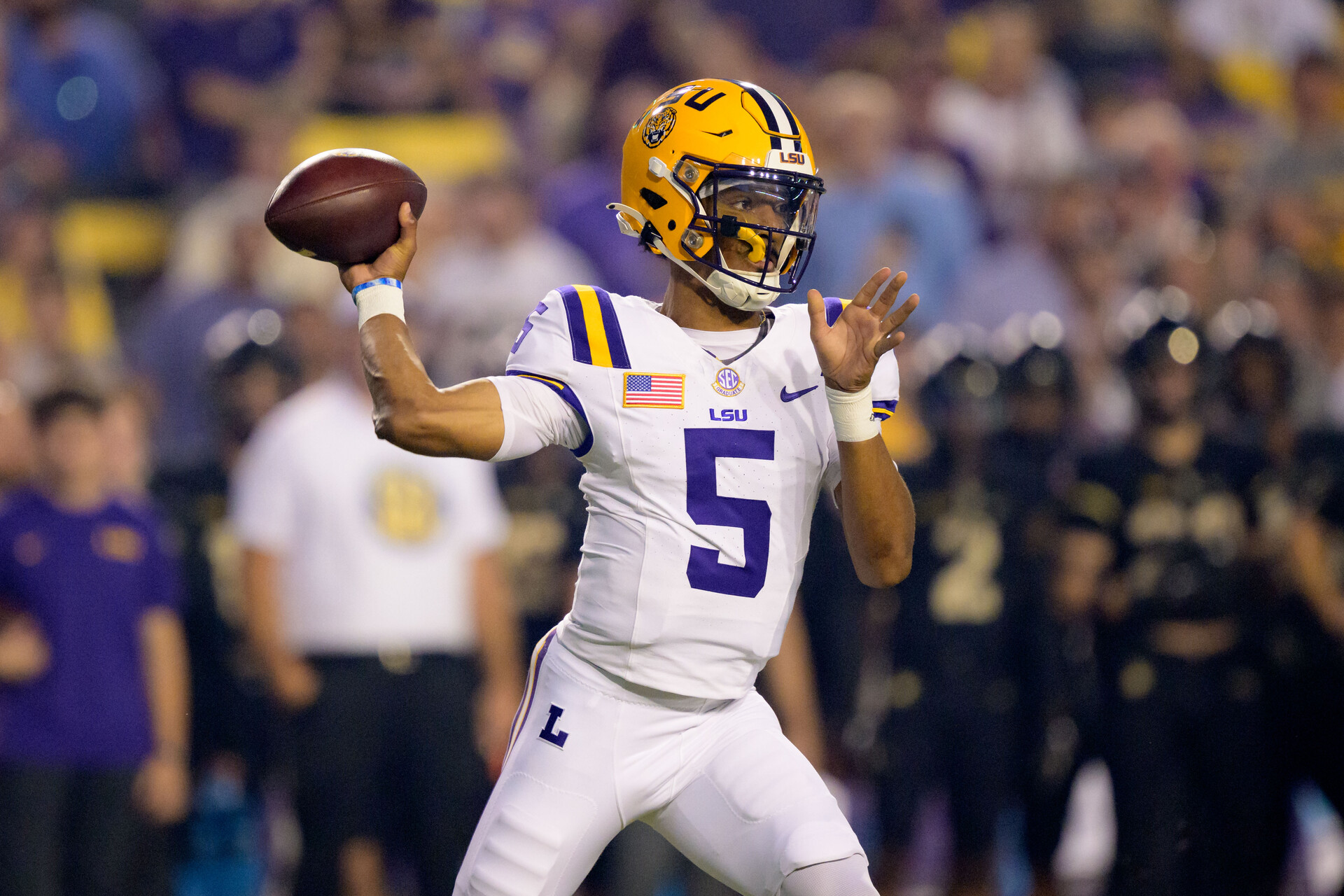 Oct 21, 2023; Baton Rouge, Louisiana, USA; LSU Tigers quarterback Jayden Daniels (5) throws against the Army Black Knights during the first quarter at Tiger Stadium.