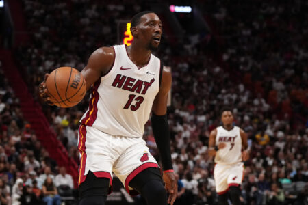 Oct 25, 2023; Miami, Florida, USA; Miami Heat center Bam Adebayo (13) dribbles the ball up the court against the Detroit Pistons during the first second half at Kaseya Center.