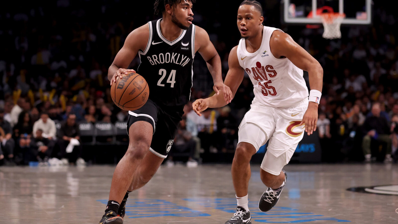 Oct 25, 2023; Brooklyn, New York, USA; Brooklyn Nets guard Cam Thomas (24) controls the ball against Cleveland Cavaliers forward Isaac Okoro (35) during the third quarter at Barclays Center.