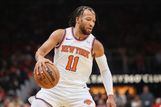 New York Knicks guard Jalen Brunson (11) dribbles against the Atlanta Hawks in the first quarter at State Farm Arena.