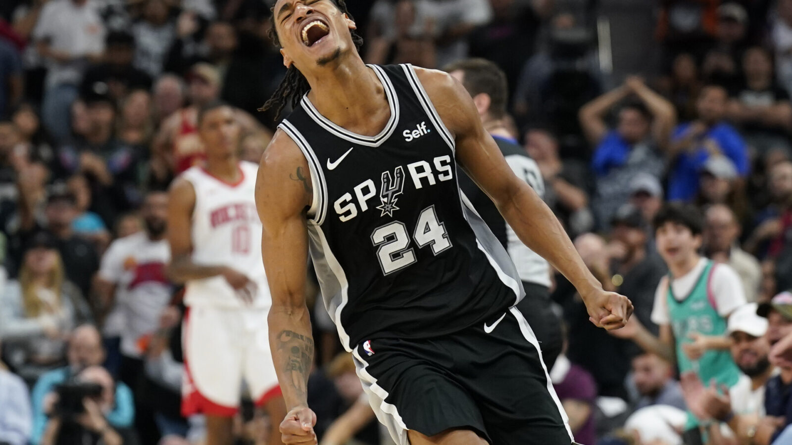 San Antonio Spurs guard Devin Vassell (24) reacts during the second half against the Houston Rockets at Frost Bank Center.