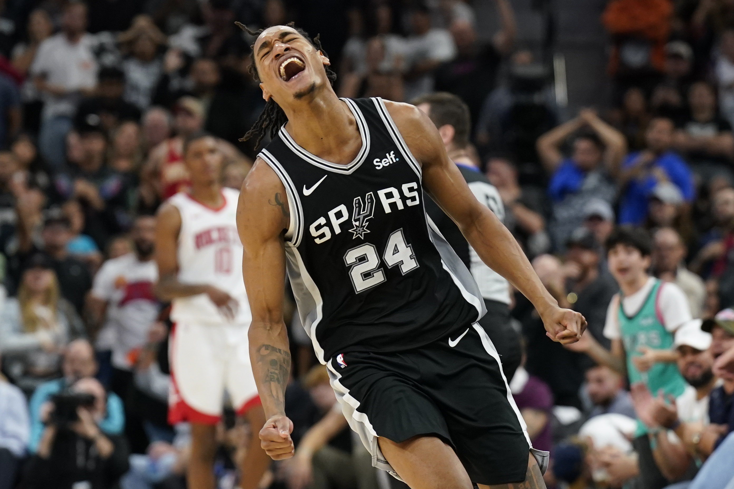 San Antonio Spurs guard Devin Vassell (24) reacts during the second half against the Houston Rockets at Frost Bank Center.