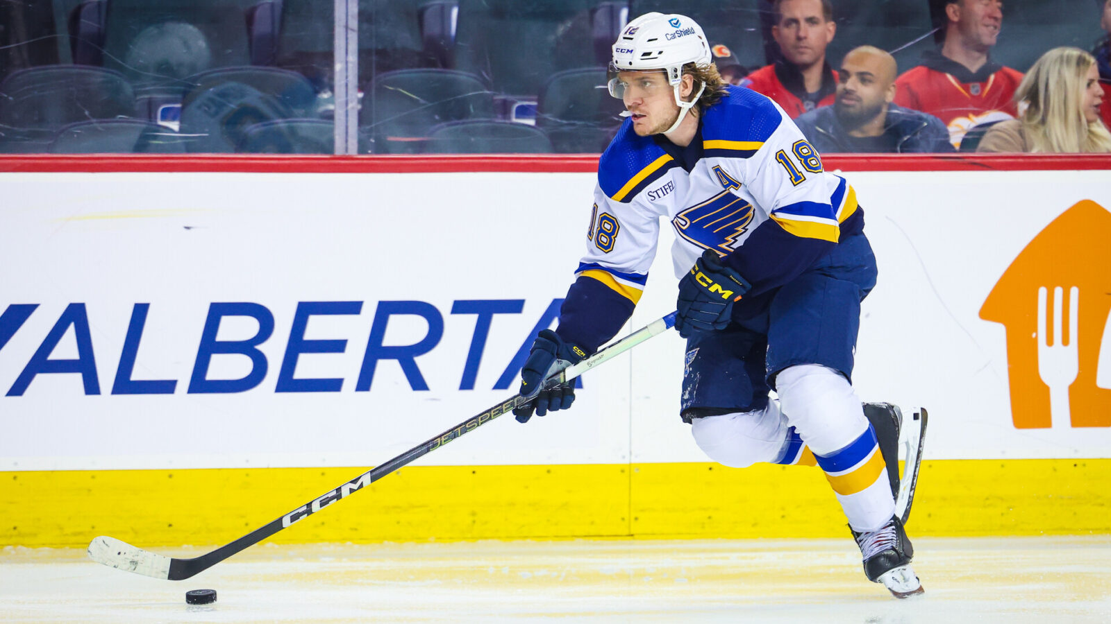 Oct 26, 2023; Calgary, Alberta, CAN; St. Louis Blues center Robert Thomas (18) skates with the puck against the Calgary Flames during the third period at Scotiabank Saddledome