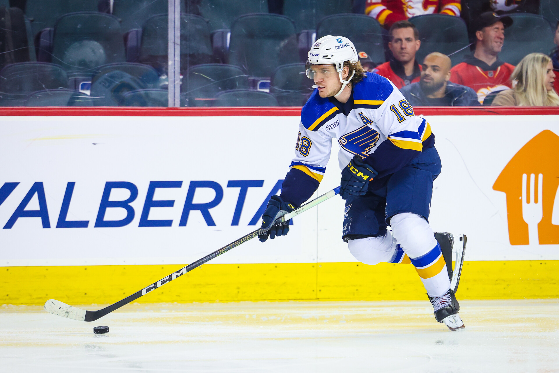 Oct 26, 2023; Calgary, Alberta, CAN; St. Louis Blues center Robert Thomas (18) skates with the puck against the Calgary Flames during the third period at Scotiabank Saddledome