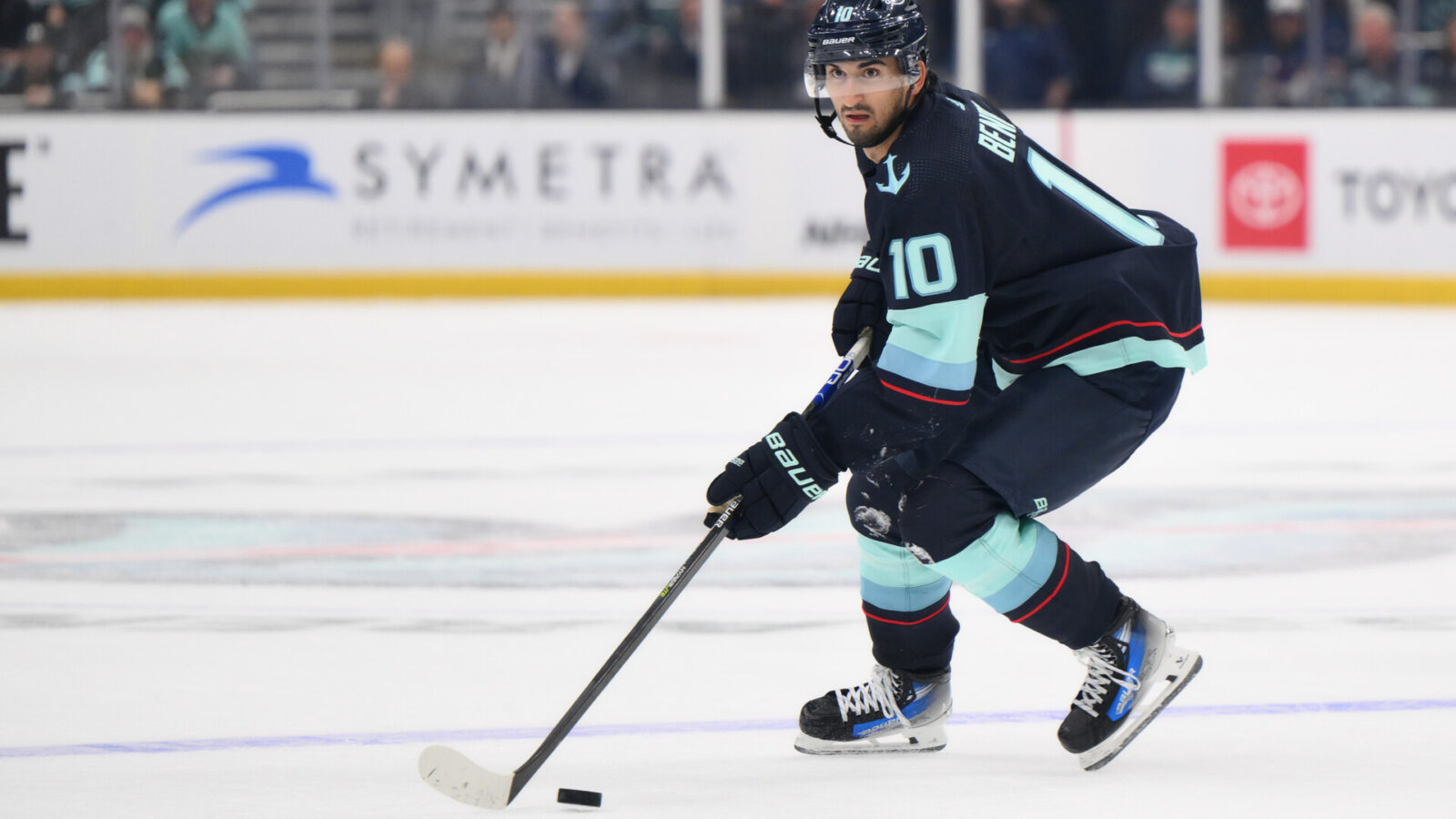 Oct 17, 2023; Seattle, Washington, USA; Seattle Kraken center Matty Beniers (10) plays the puck against the Colorado Avalanche during the game at Climate Pledge Arena.