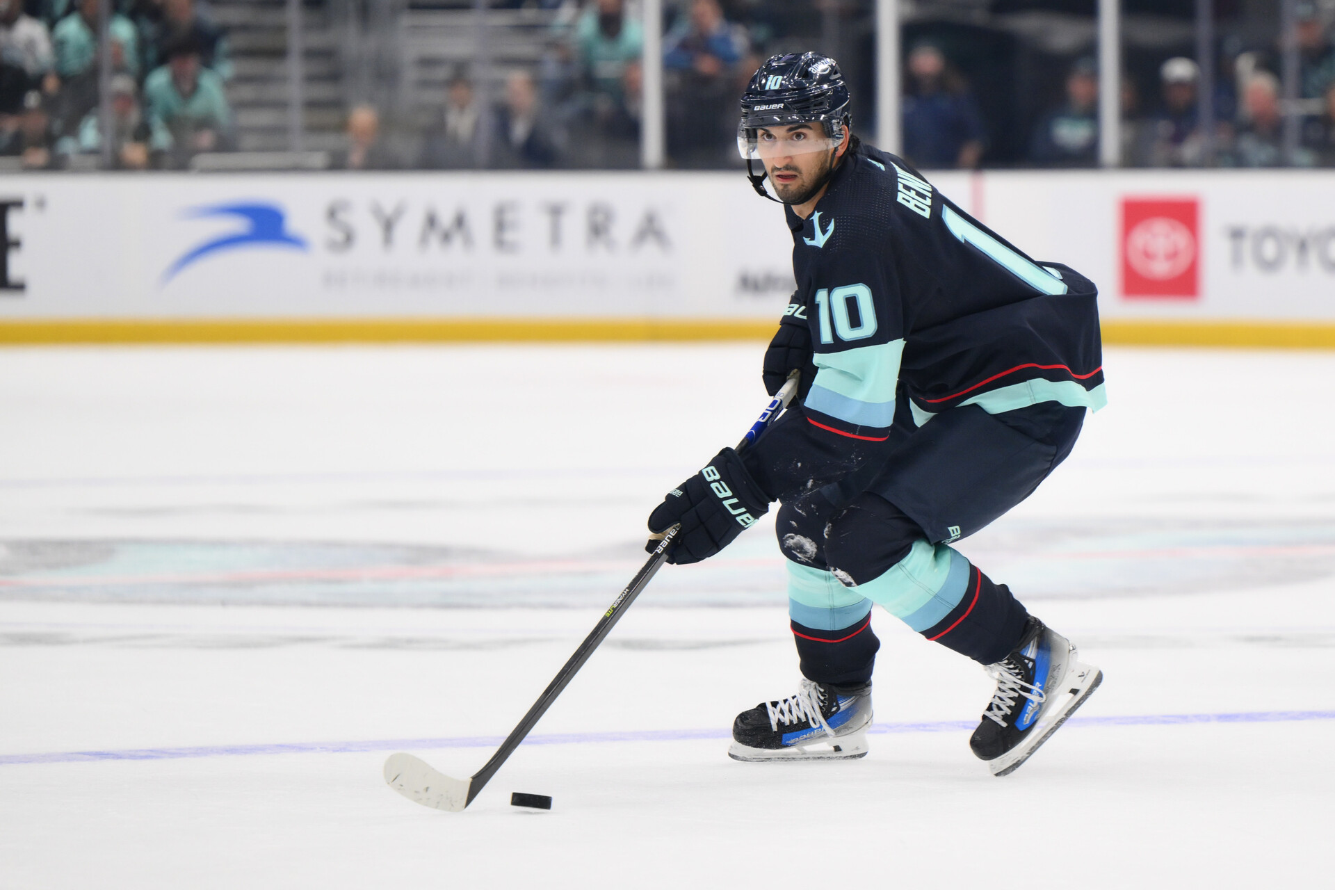 Oct 17, 2023; Seattle, Washington, USA; Seattle Kraken center Matty Beniers (10) plays the puck against the Colorado Avalanche during the game at Climate Pledge Arena.