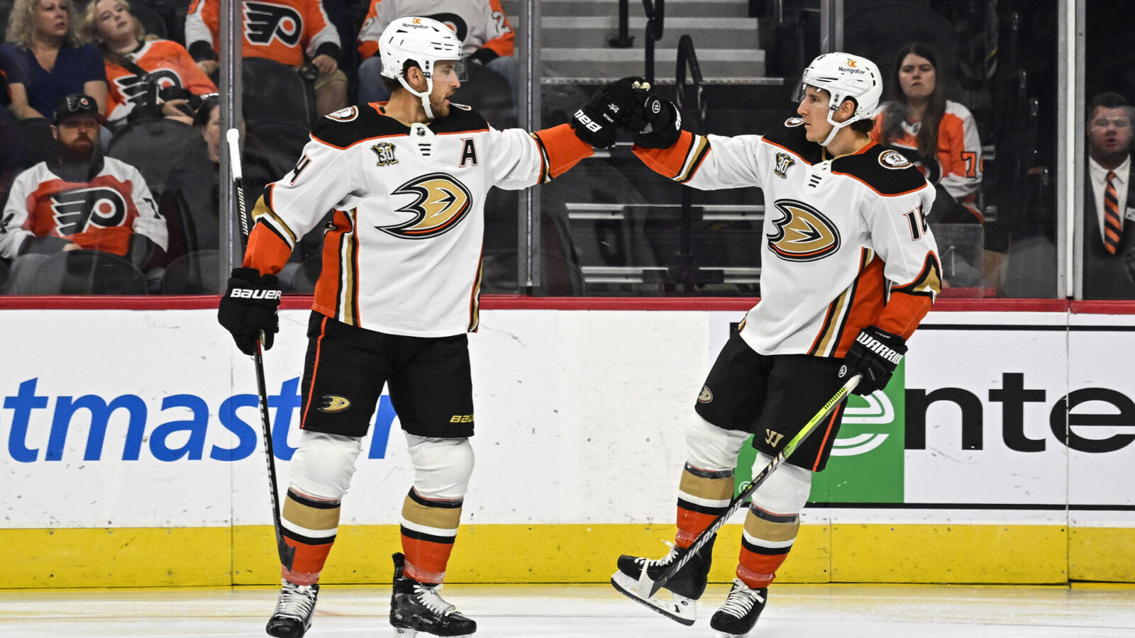 Oct 28, 2023; Philadelphia, Pennsylvania, USA; Anaheim Ducks center Ryan Strome (16) celebrates his goal with defenseman Cam Fowler (4) during the first period against the Philadelphia Flyers at Wells Fargo Center.