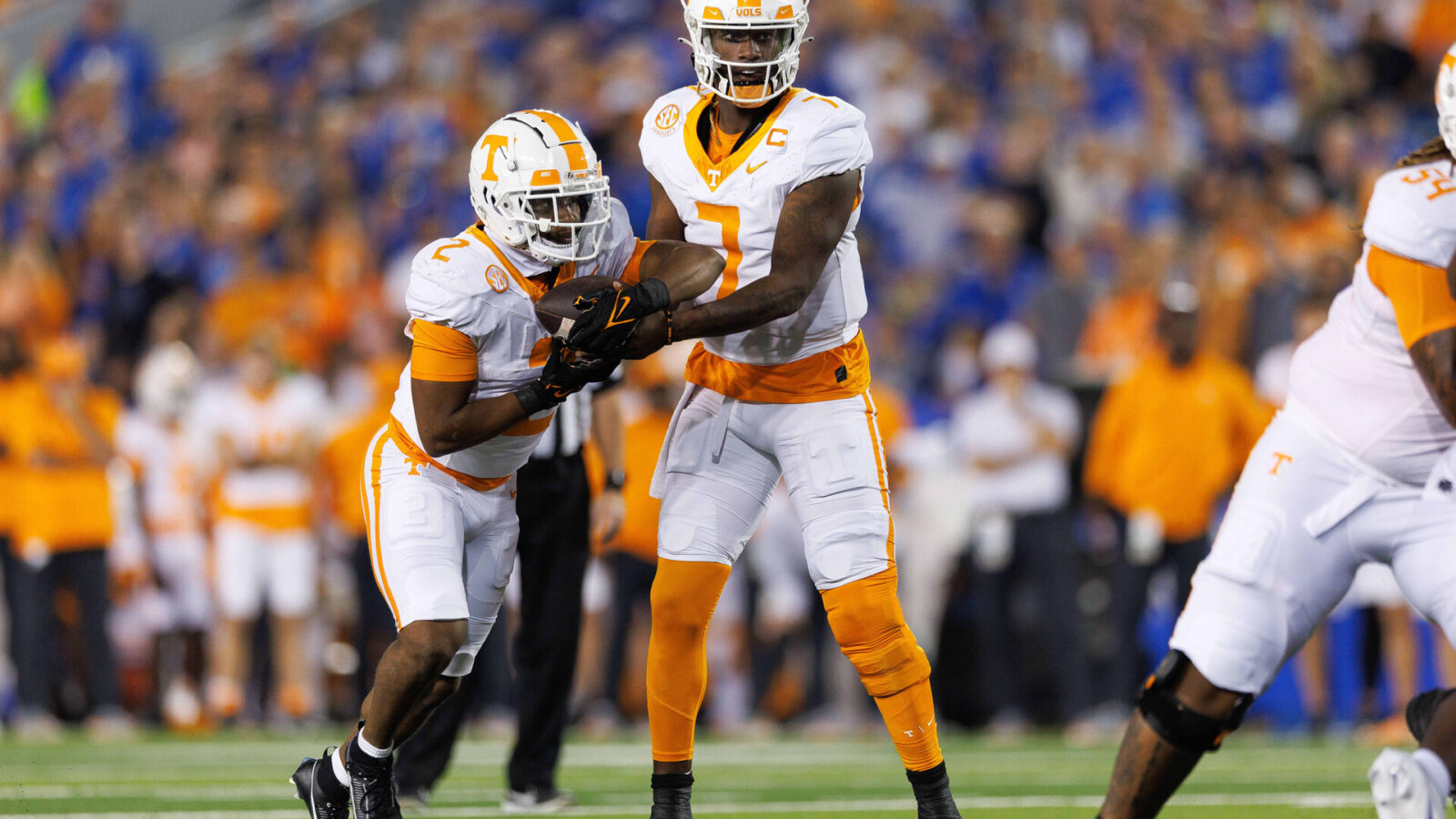 Oct 28, 2023; Lexington, Kentucky, USA; Tennessee Volunteers quarterback Joe Milton III (7) hands the ball off to Tennessee Volunteers running back Jabari Small (2) during the first quarter against the Kentucky Wildcats at Kroger Field.