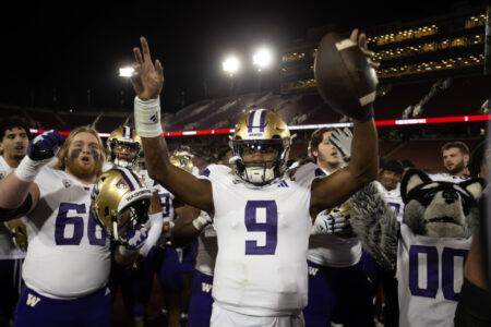 Oct 28, 2023; Stanford, California, USA; Washington Huskies quarterback Michael Penix Jr. (9) and his teammates celebrate their victory over the Stanford Cardinal at Stanford Stadium.