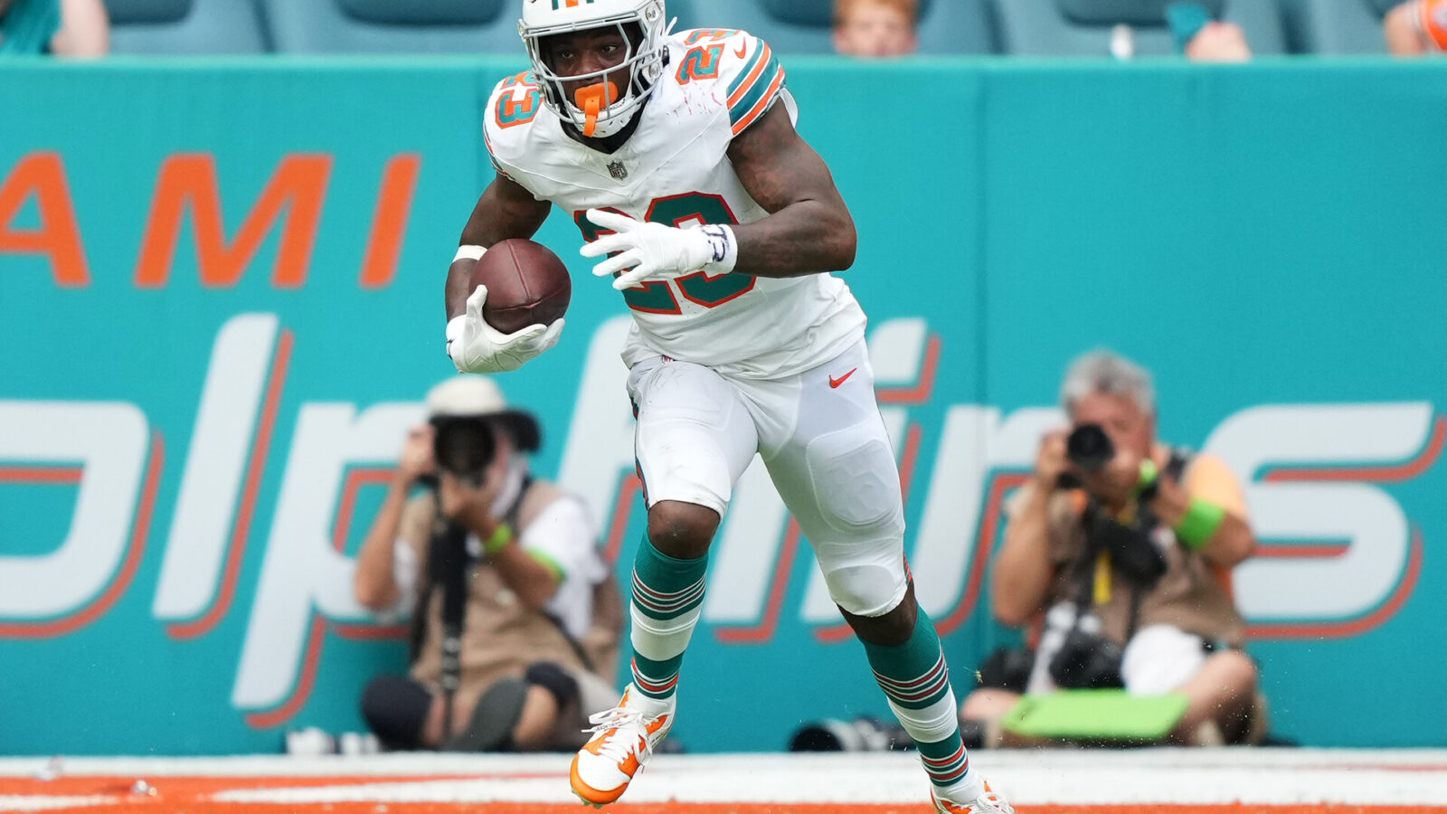 Oct 29, 2023; Miami Gardens, Florida, USA; Miami Dolphins running back Jeff Wilson Jr. (23) runs the ball against the New England Patriots during the second half at Hard Rock Stadium.