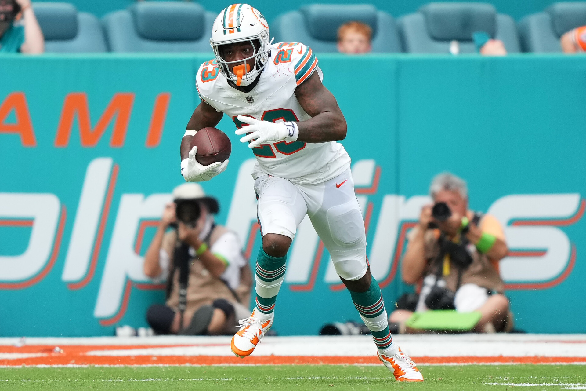 Oct 29, 2023; Miami Gardens, Florida, USA; Miami Dolphins running back Jeff Wilson Jr. (23) runs the ball against the New England Patriots during the second half at Hard Rock Stadium.