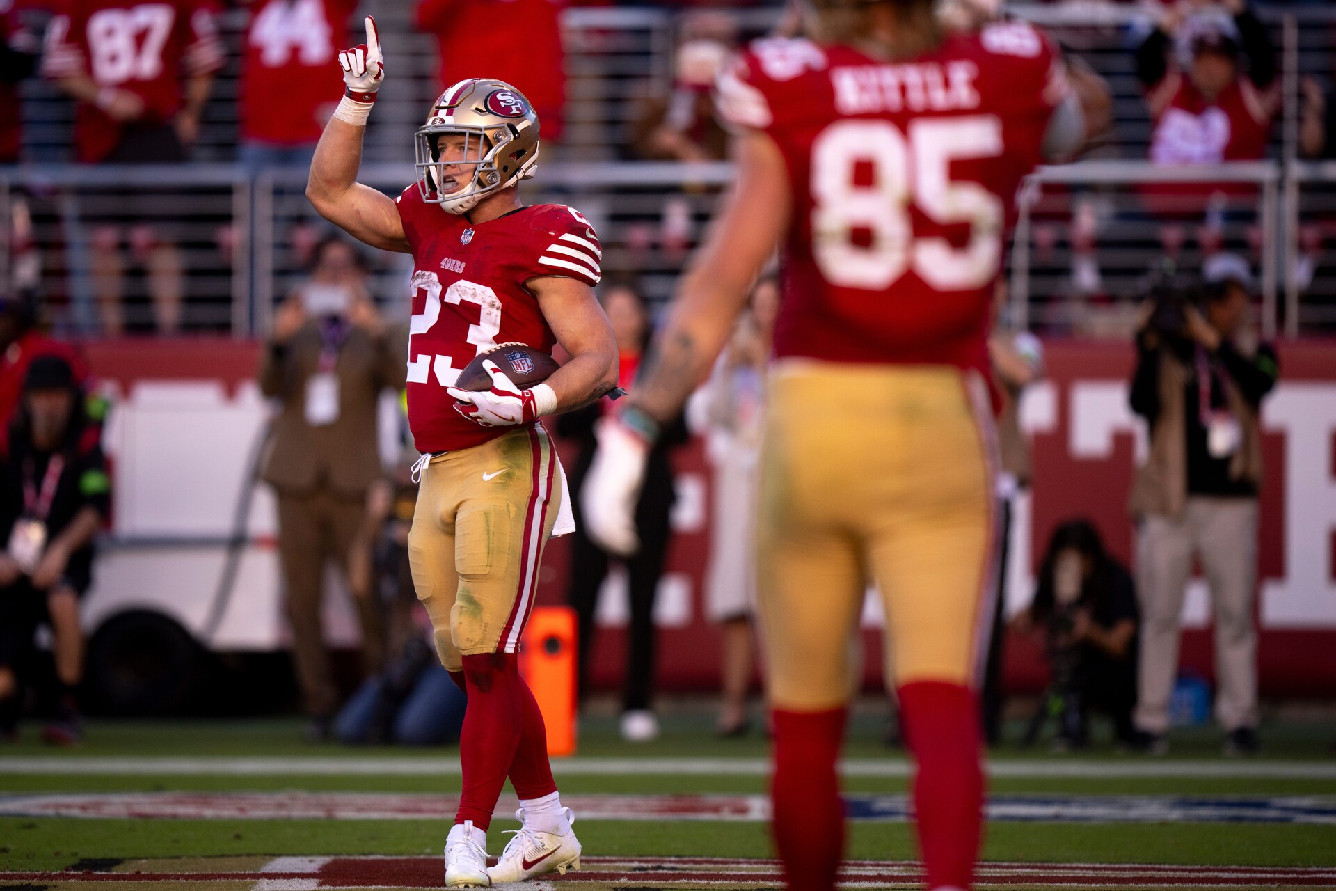 Is Sports Betting Legal In California? Best CA Betting Apps - San Francisco 49ers running back Christian McCaffery celebrates a touchdown while teammate George Kittle looks on.