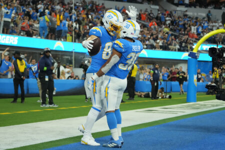 Oct 29, 2023; Inglewood, California, USA; Los Angeles Chargers wide receiver Simi Fehoko (87) celebrates with running back Austin Ekeler (30) after scoring on a 9-yard touchdown reception against the Chicago Bears in the first half at SoFi Stadium.