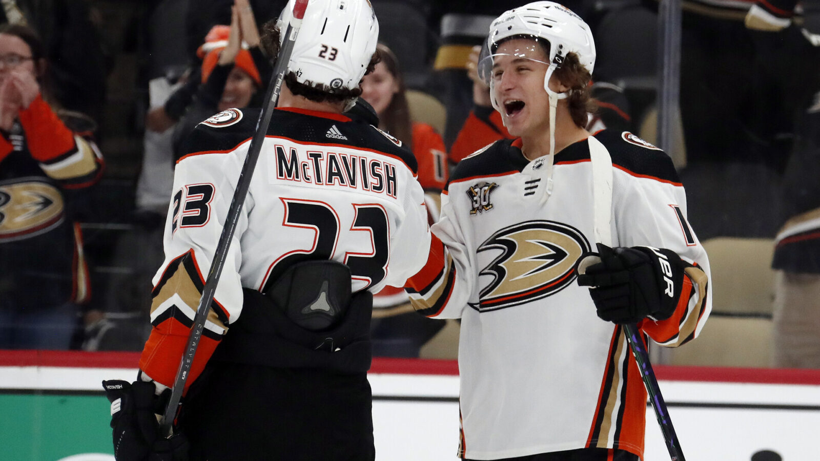 Anaheim Ducks center Mason McTavish (23) and center Trevor Zegras (right) celebrate after defeating the Pittsburgh Penguins at PPG Paints Arena. Anaheim won 4-3.