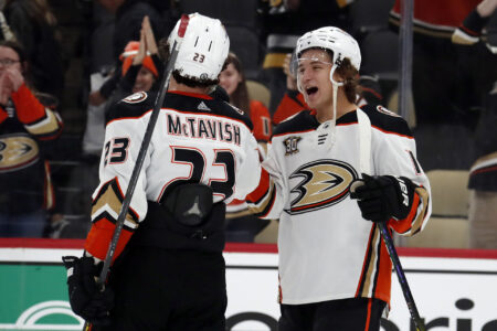 Anaheim Ducks center Mason McTavish (23) and center Trevor Zegras (right) celebrate after defeating the Pittsburgh Penguins at PPG Paints Arena. Anaheim won 4-3.
