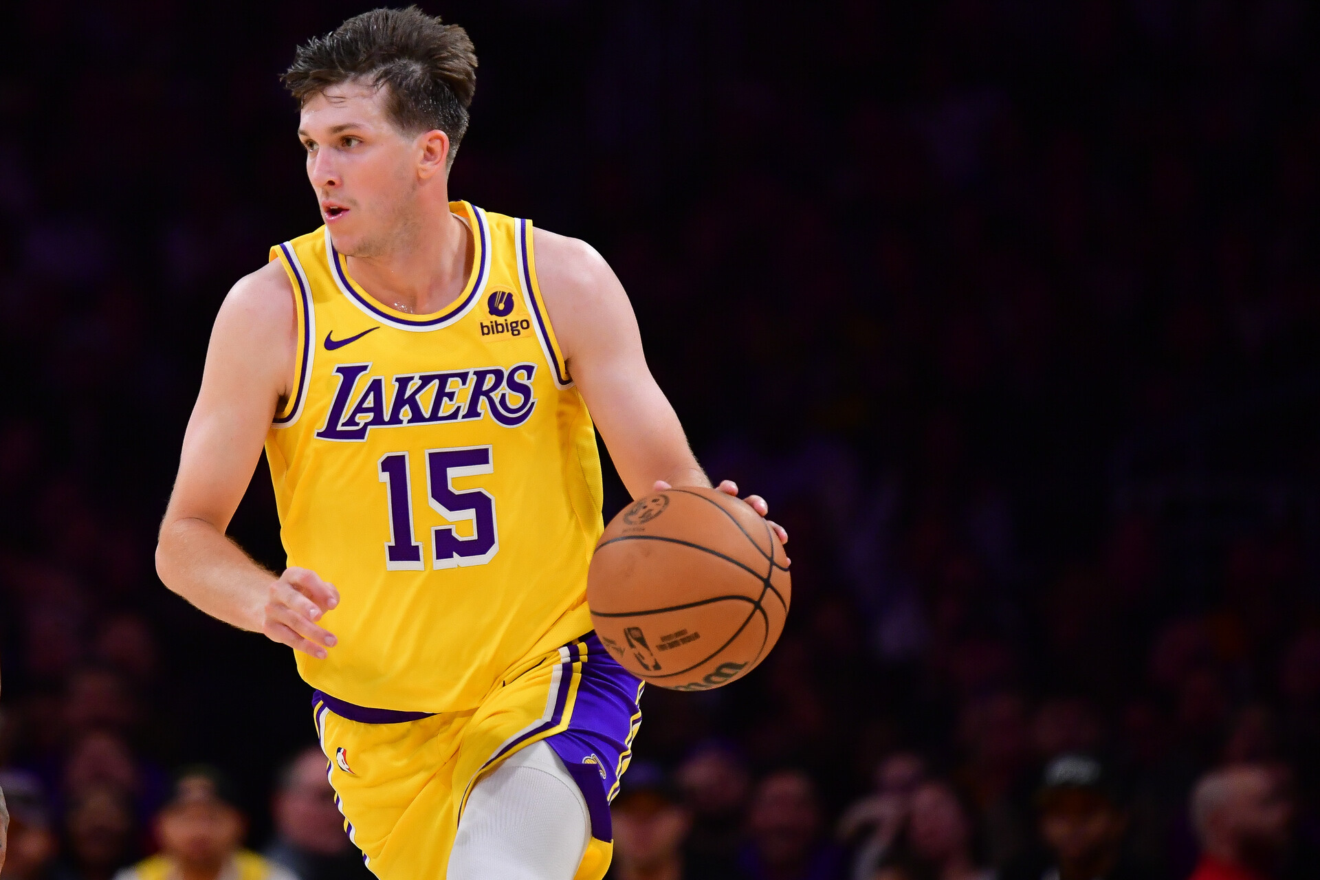 Los Angeles Lakers guard Austin Reaves (15) moves the ball up court against the Orlando Magic during the second half at Crypto.com Arena.
