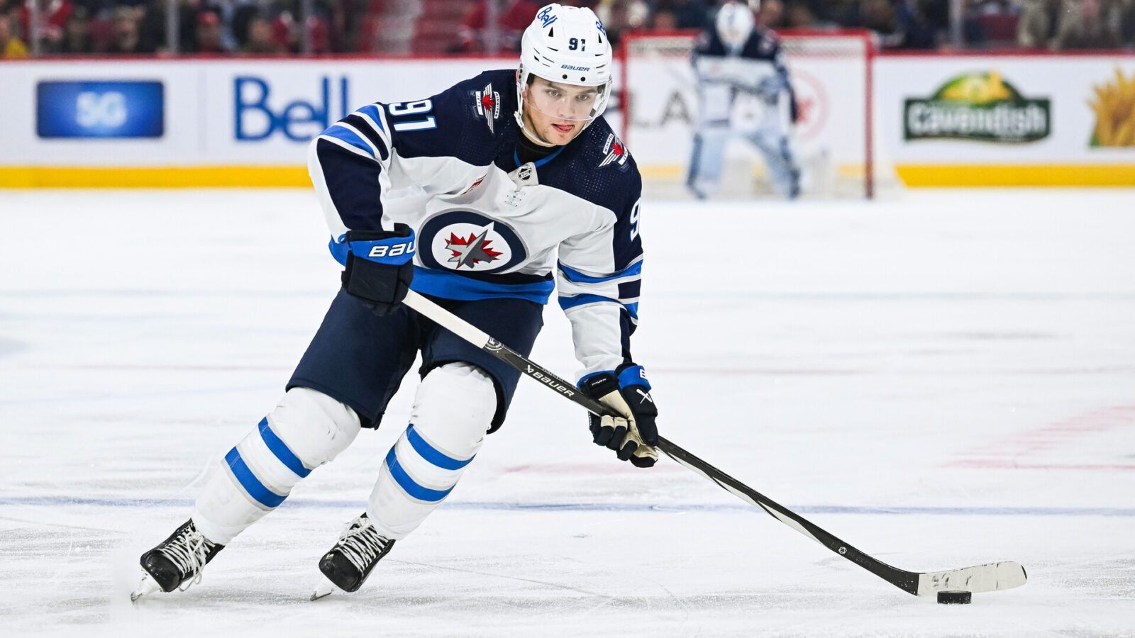 Oct 28, 2023; Montreal, Quebec, CAN; Winnipeg Jets center Cole Perfetti (91) plays the puck against the Montreal Canadiens during the third period at Bell Centre.