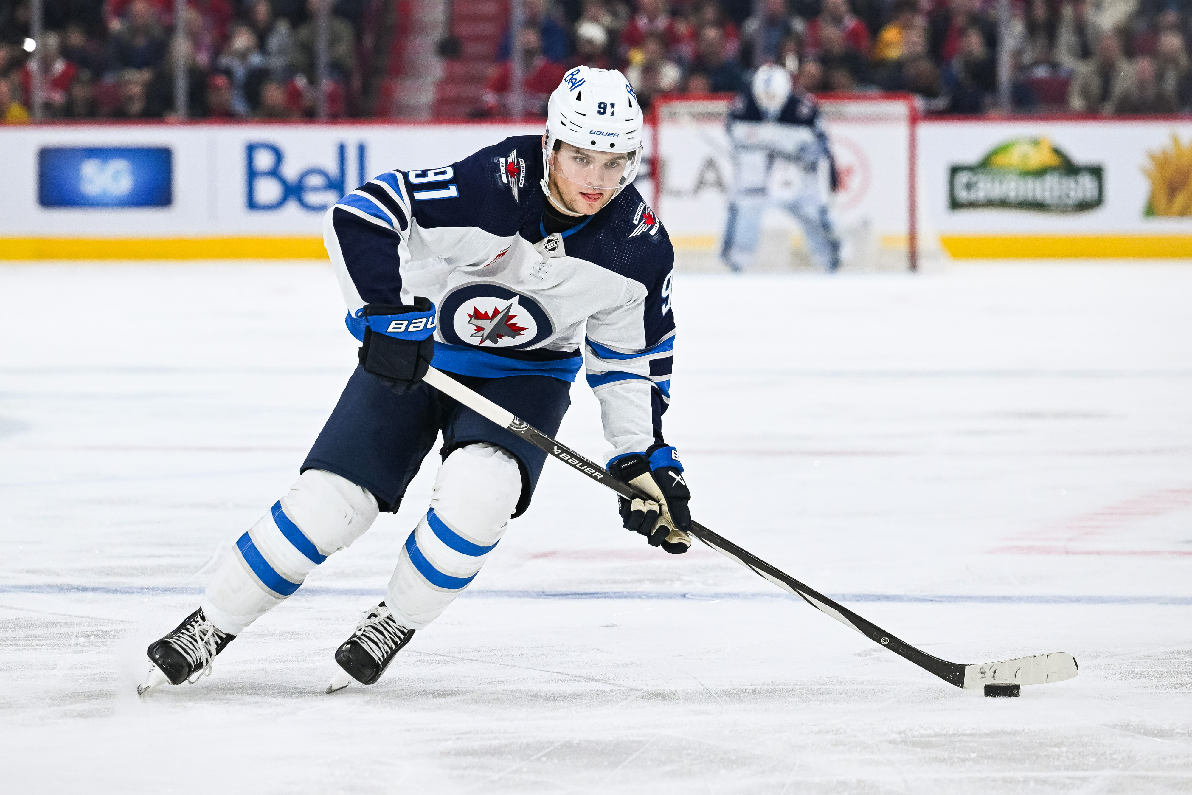 Oct 28, 2023; Montreal, Quebec, CAN; Winnipeg Jets center Cole Perfetti (91) plays the puck against the Montreal Canadiens during the third period at Bell Centre