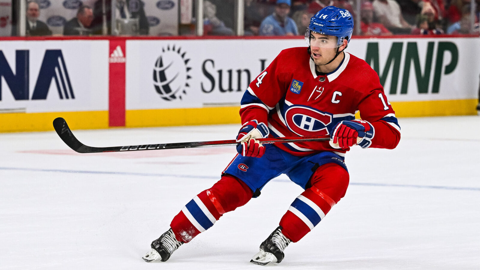 Oct 28, 2023; Montreal, Quebec, CAN; Montreal Canadiens center Nick Suzuki (14) against the Winnipeg Jets during overtime at Bell Centre.