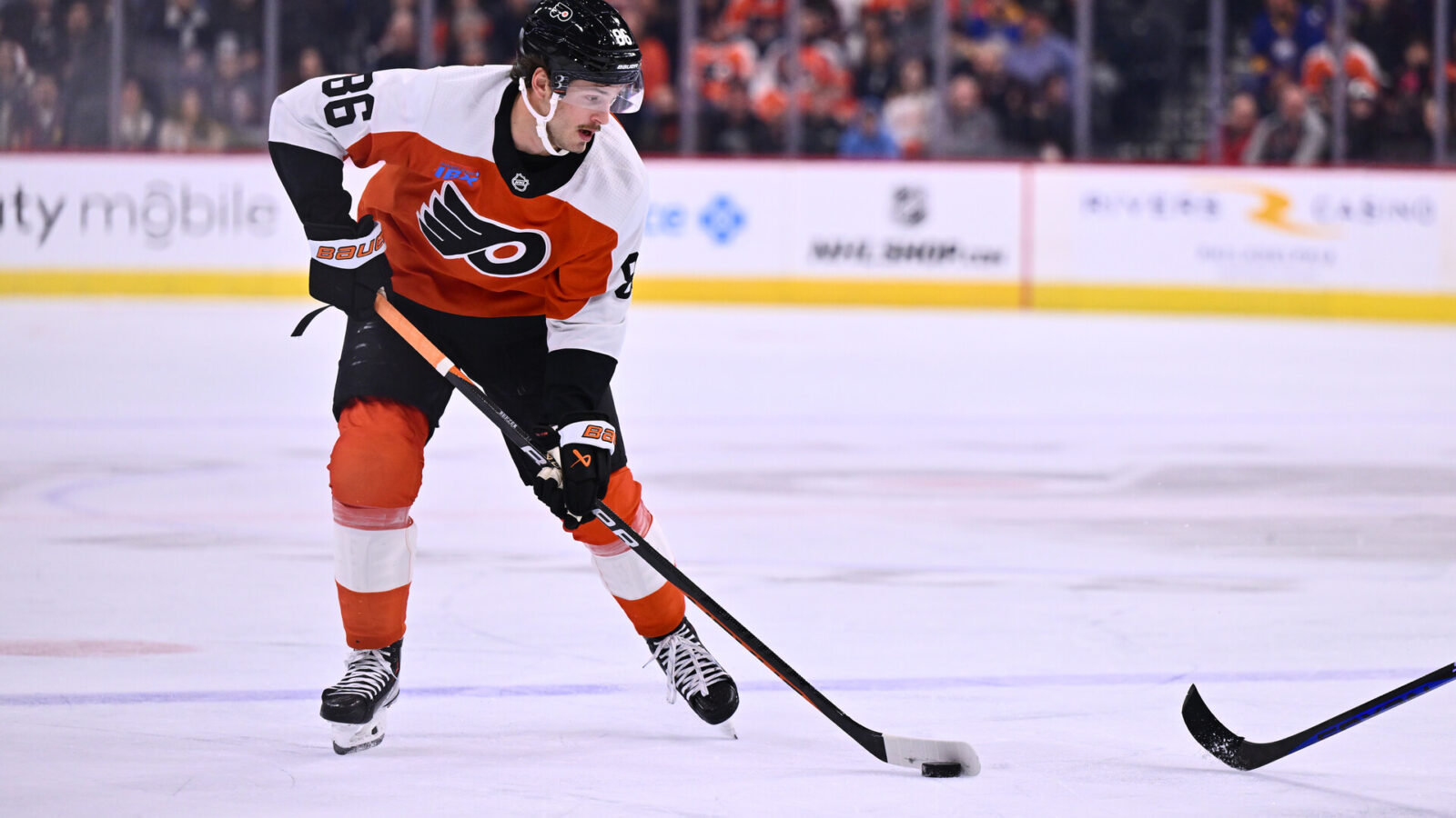 Nov 1, 2023; Philadelphia, Pennsylvania, USA; Philadelphia Flyers left wing Joel Farabee (86) controls the puck against the Buffalo Sabres in the first period at Wells Fargo Center.