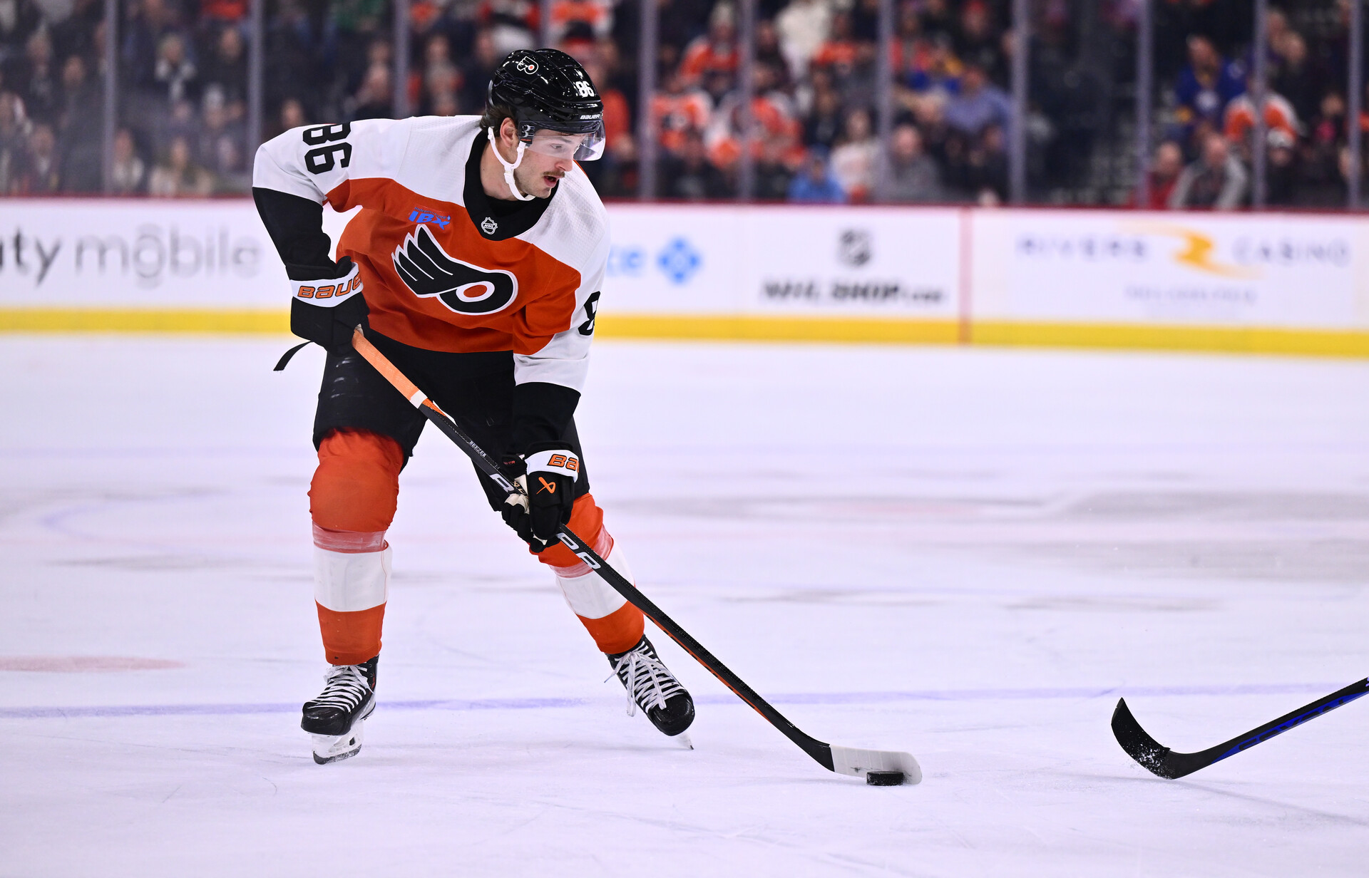 Nov 1, 2023; Philadelphia, Pennsylvania, USA; Philadelphia Flyers left wing Joel Farabee (86) controls the puck against the Buffalo Sabres in the first period at Wells Fargo Center.