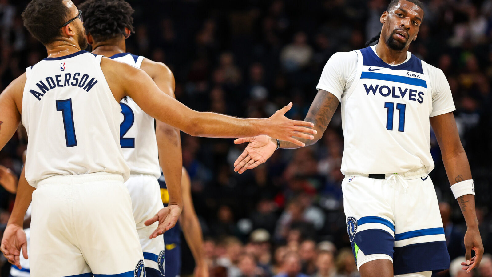 Minneapolis, Minnesota, USA; Minnesota Timberwolves center Naz Reid (11) celebrates with forward Kyle Anderson (1) during the first half against the Denver Nuggets at Target Center.