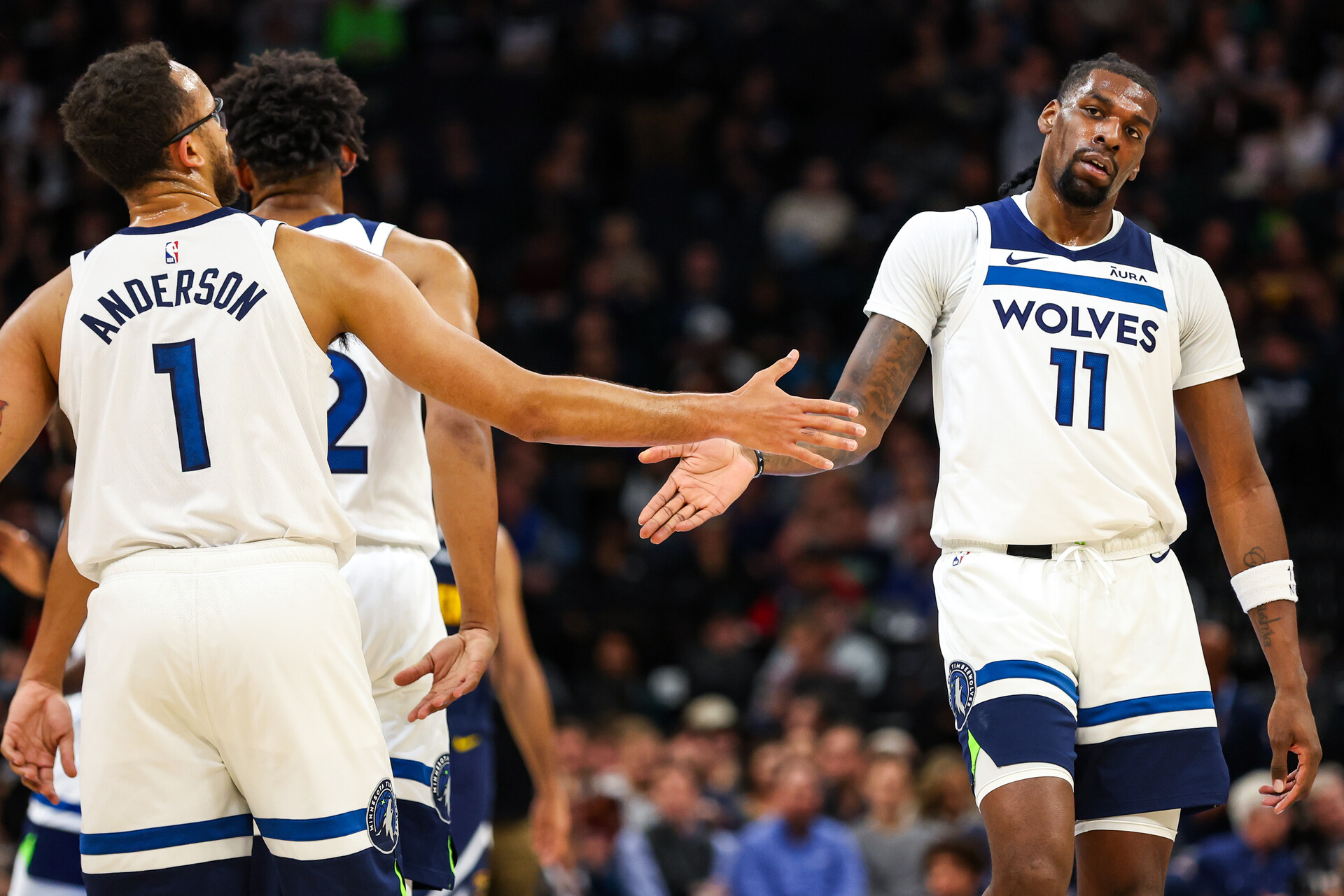 Minneapolis, Minnesota, USA; Minnesota Timberwolves center Naz Reid (11) celebrates with forward Kyle Anderson (1) during the first half against the Denver Nuggets at Target Center.