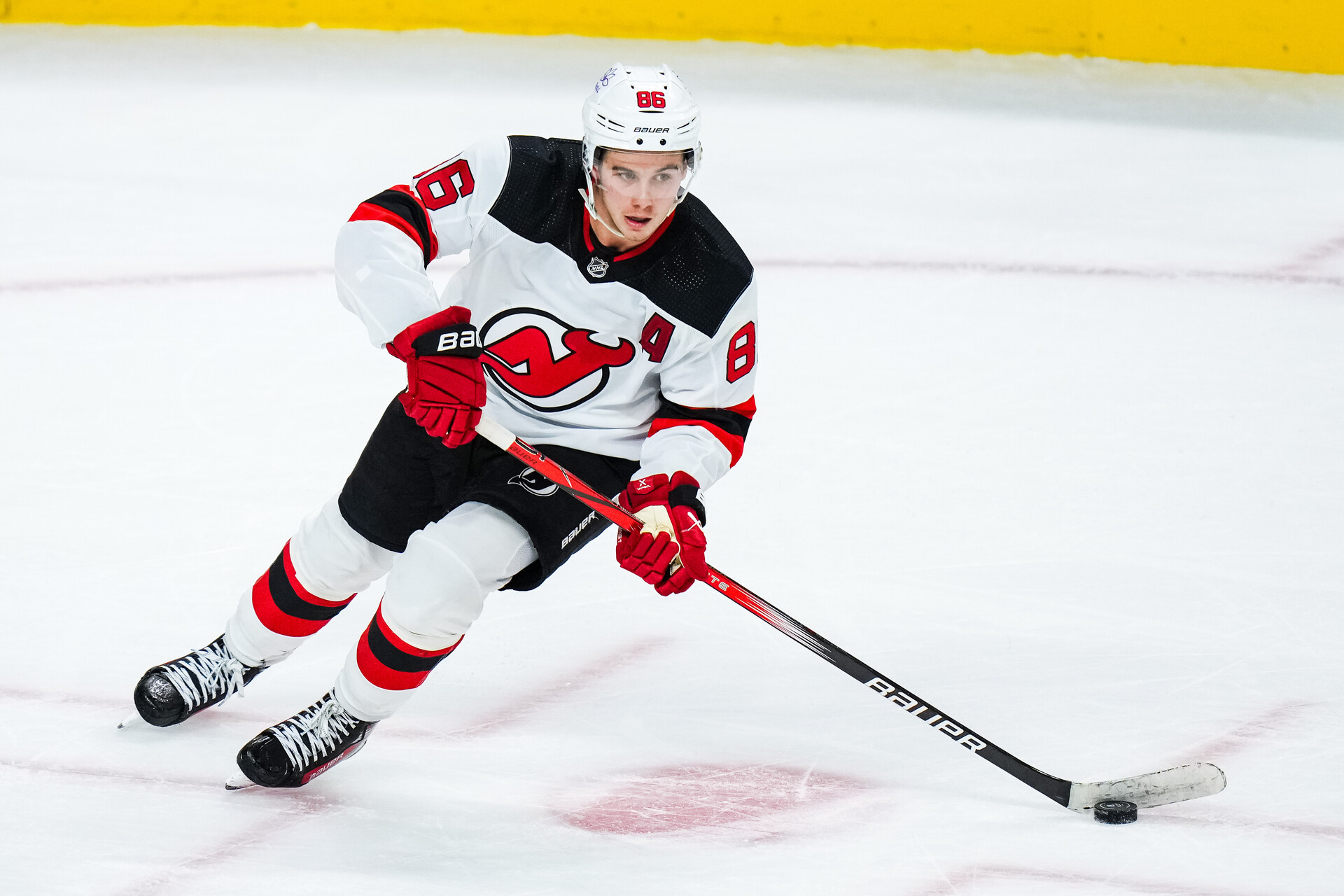 Nov 2, 2023; Saint Paul, Minnesota, USA; New Jersey Devils center Jack Hughes (86) carries the puck during the third period against the Minnesota Wild at Xcel Energy Center.