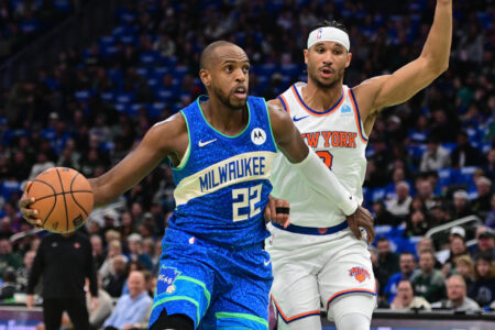 Milwaukee Bucks center Khris Middleton (22) drives for the basket against New York Knicks guard Josh Hart (3) in the first quarter at Fiserv Forum.