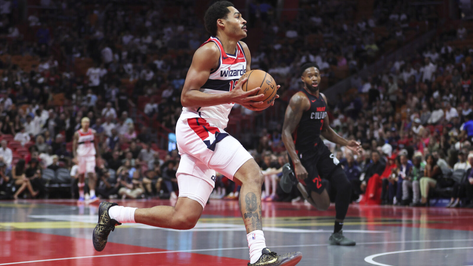 Nov 3, 2023; Miami, Florida, USA; Washington Wizards guard Jordan Poole (13) drives to the basket against the Miami Heat during the first quarter at Kaseya Center