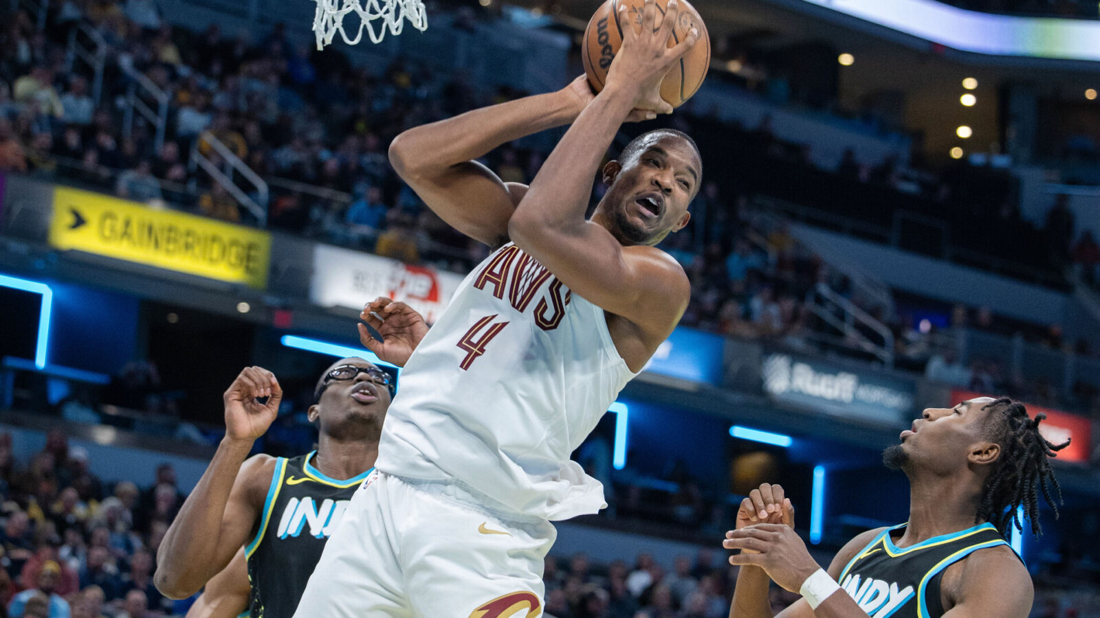 Cleveland Cavaliers forward Evan Mobley (4) rebounds the ball while Indiana Pacers forward Aaron Nesmith (23) defends in the second half at Gainbridge Fieldhouse.